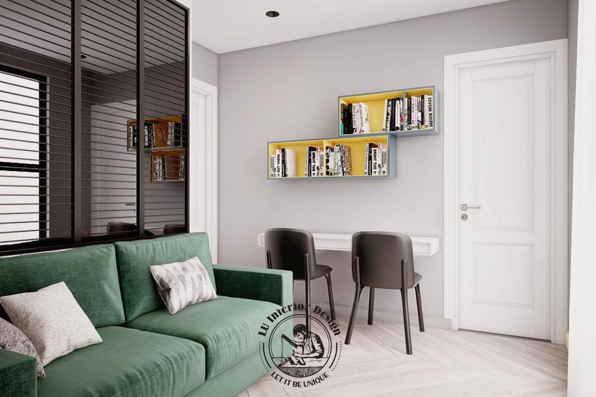Sofa màu xanh lá kết hợp kệ treo tường tạo nên một góc thư giãn nhẹ nhàng và tinh tế.