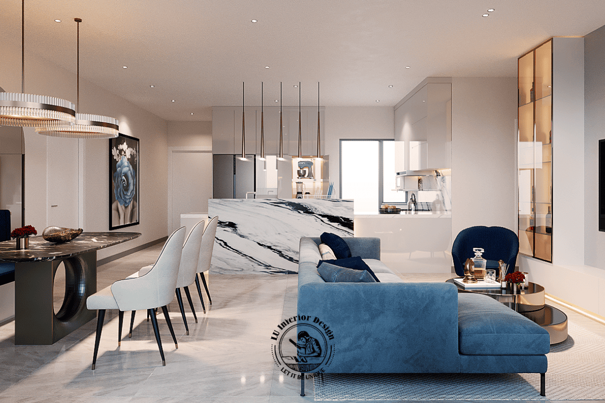 Góc nhìn từ phía sau sofa làm nổi bật hệ đảo bếp ốp đá marble vân mây đen trắng, đóng vai trò ranh giới ước lệ ngăn cách khu vực tiếp khách và không gian nấu 