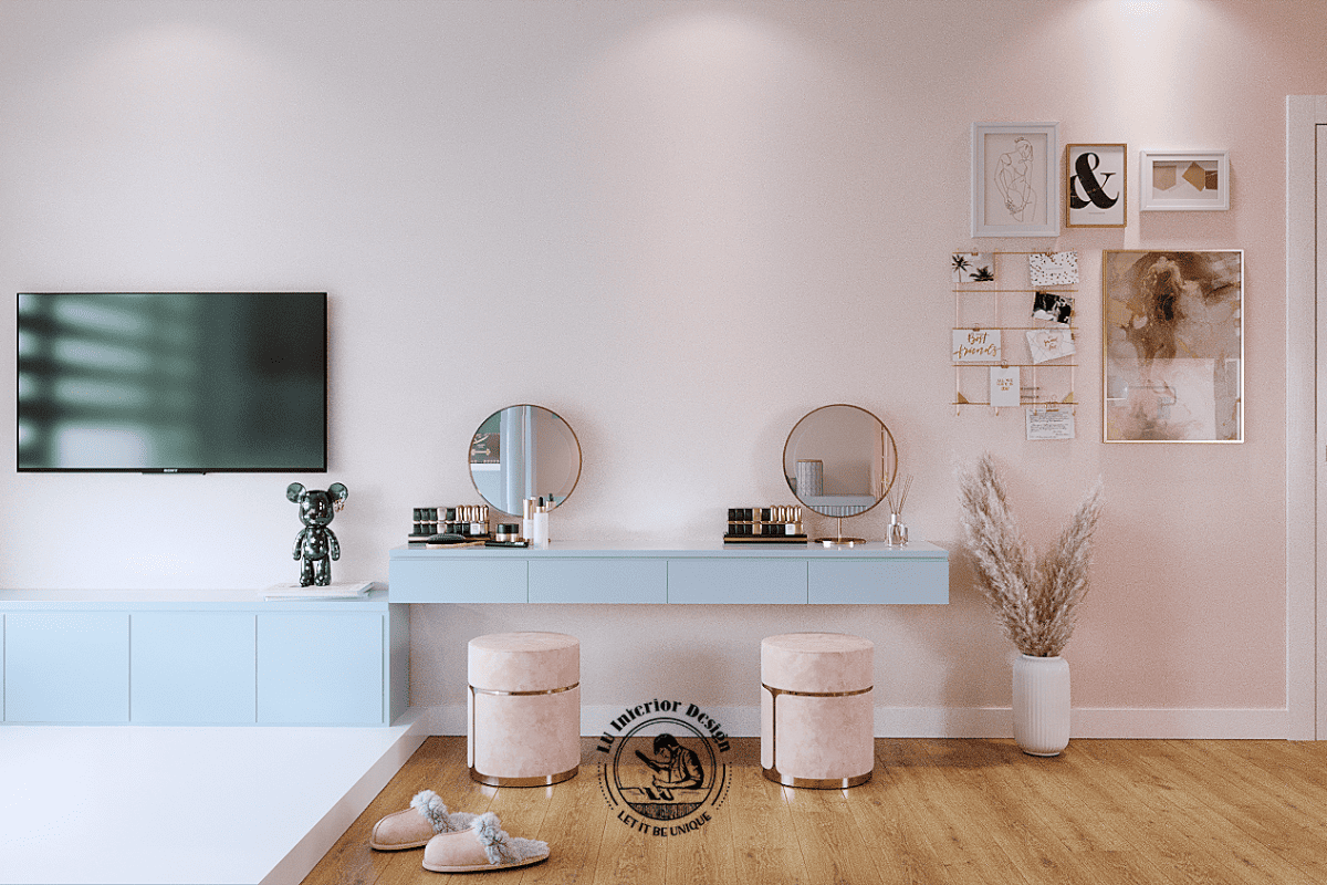 Khu vực kệ tivi và bàn trang điểm sử dụng cốt gỗ công nghiệp sơn phủ màu xanh pastel, kết hợp hệ thống đôn ngồi bọc nỉ chân viền kim 