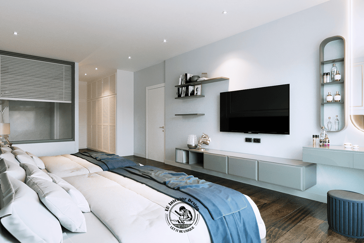 Khu vực kệ tivi đối diện giường ngủ được xử lý bằng hệ tủ treo tường màu xám kịch trần, kết hợp với bàn trang điểm liền khối và gương soi tích hợp đèn led âm