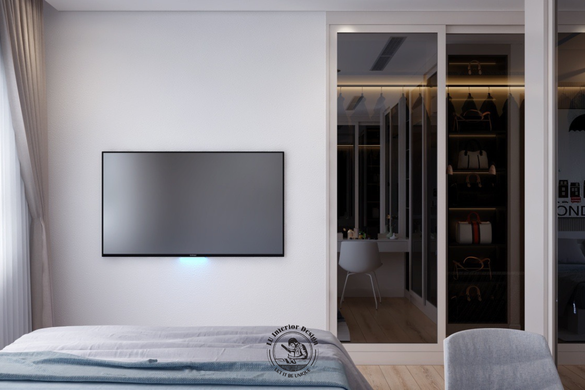 Mảng tường treo TV đối diện giường ngủ được thiết kế tối giản, tạo lối đi thông thoáng và không gian thư giãn trọn vẹn