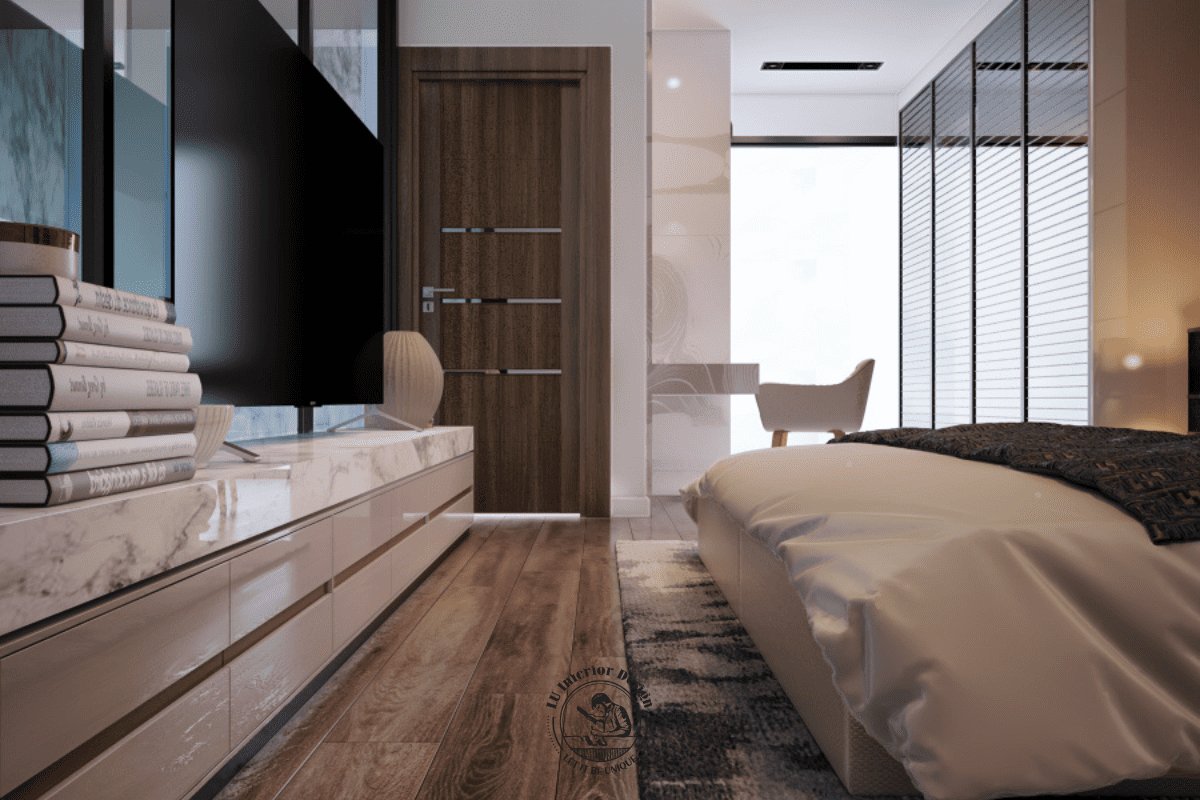 Kệ tivi đối diện giường ngủ sử dụng mặt đá marble kết hợp hệ hộc kéo phủ sơn bóng, bố trí chạy dọc theo lối giao thông vào phòng ngủ