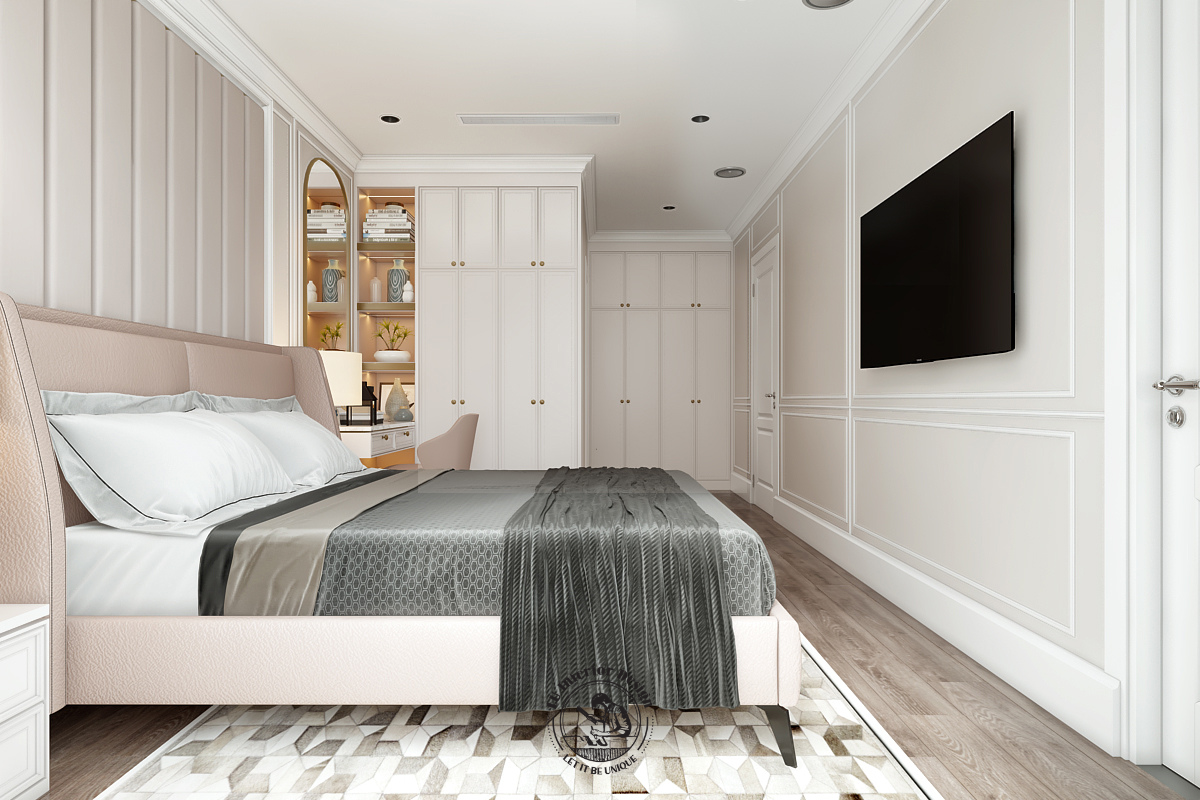 Tivi treo phẳng trên diện tường chạy phào chỉ thạch cao trang nhã, đối diện giường ngủ nhằm tối ưu lối di chuyển ra vào phòng tắm