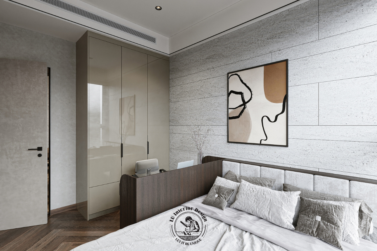 Góc nhìn cận cảnh giường ngủ đặt cạnh mảng tường ốp đá nhám giả cổ mộc mạc và hệ tủ cánh phẳng bóng gương sang trọng