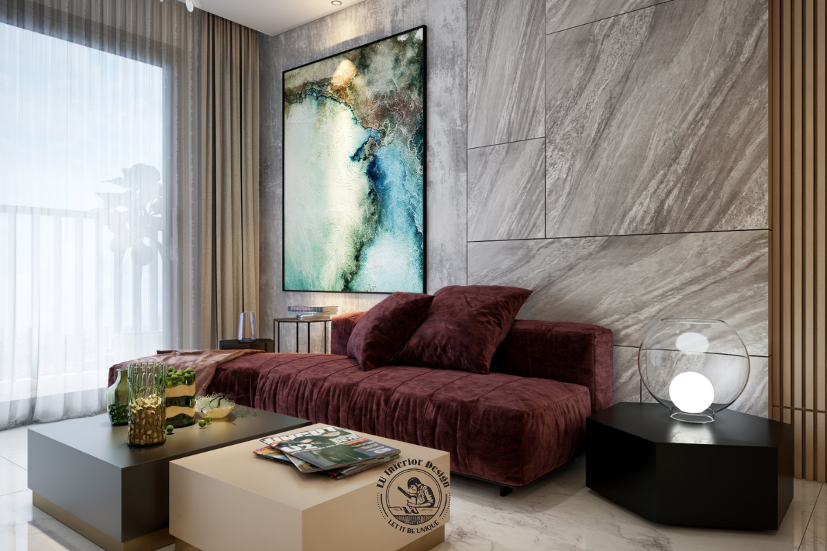 Sofa màu đỏ mận nổi bật trên nền vách ốp giả đá xám, kết hợp tranh nghệ thuật khổ lớn và hệ bàn trà hình khối tối giản