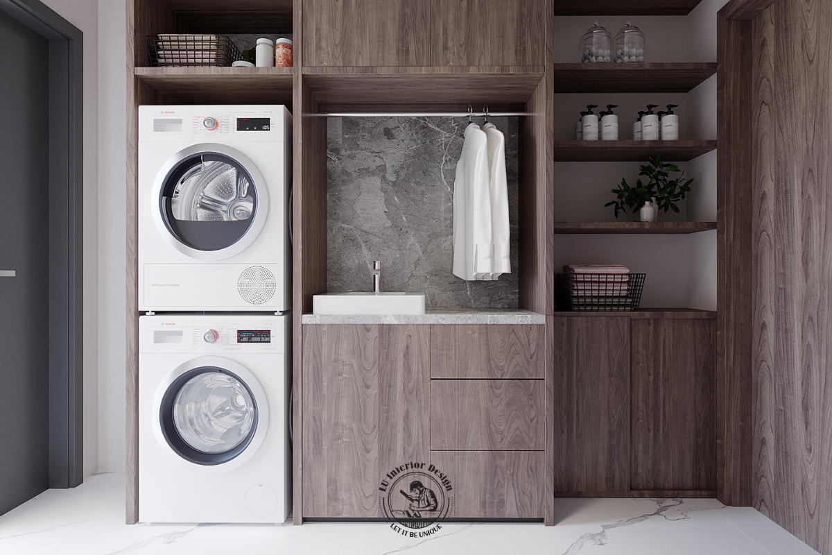 Khu vực giặt giũ được LU DESIGN bố trí hệ tủ kịch trần, máy giặt – máy sấy xếp tầng và bồn rửa tiện dụng, giúp tối ưu diện tích, tăng khả năng lưu trữ và giữ không gian luôn gọn gàng