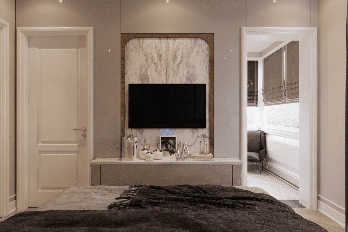Tivi treo trên nền đá marble vân mây, cạnh bên là lối dẫn vào ban công và phòng thay đồ