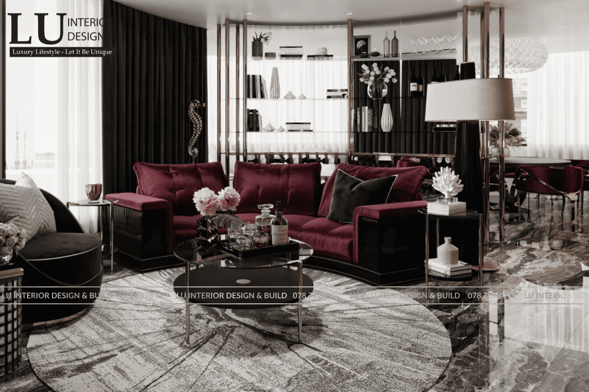 Thiết kế phòng khách penthouse Vũng Tàu tone đỏ rượu vang thiết kế modern classic với sofa nhung và kệ rượu sang trọng