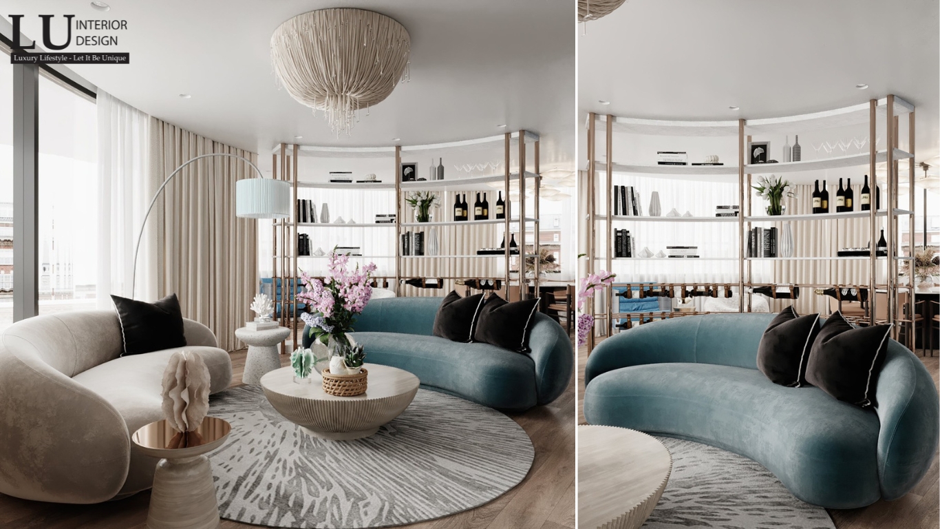phòng khách tone xanh penthouse Vũng Tàu thiết kế hiện đại cổ điển với sofa cong và đèn chùm sang trọng