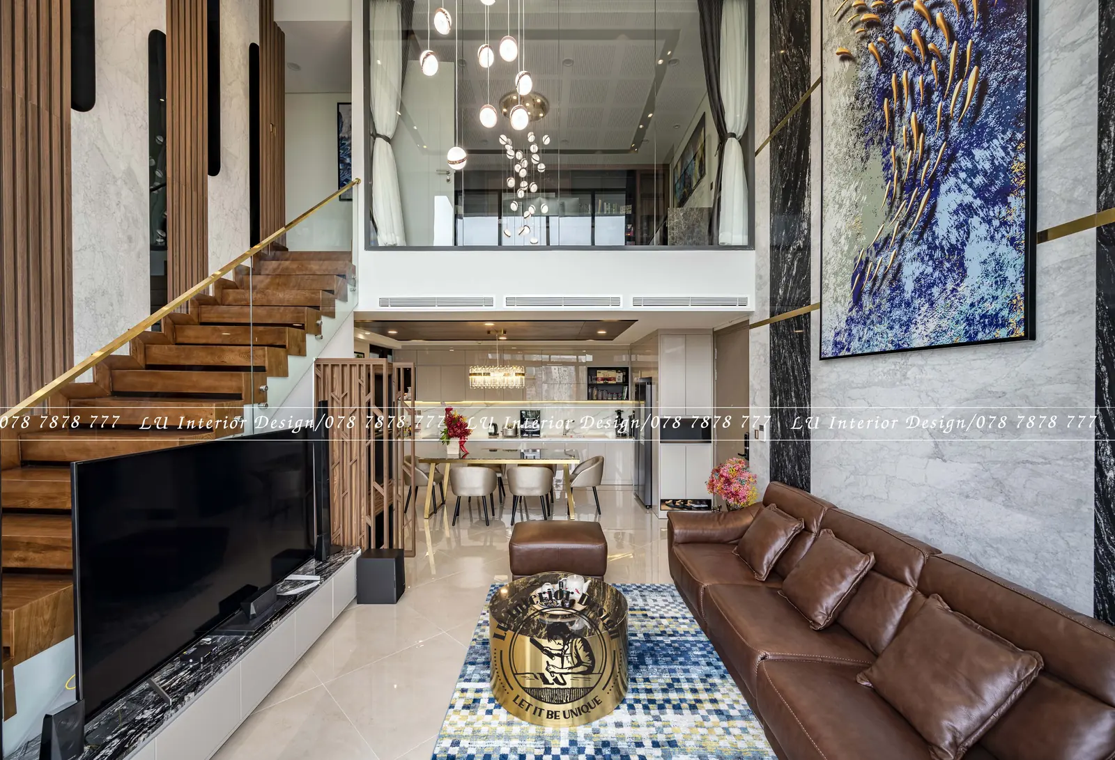 Cầu thang lan can kính nhìn từ phòng khách – hình ảnh thực tế công trình căn hộ Duplex 3PN 148m² – LU Design